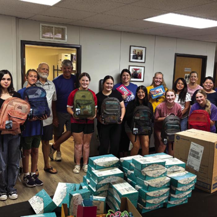 Volunteers from the Lions Club and their youth affiliate the Leo Club as well as volunteers from the Interact Club and National Honor Society all teamed together to help stuff 600 backpacks with school supplies for Saturday’s. Photos by Diana Wilson and Jeff Wick