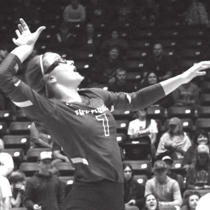 Fayetteville’s Brooklyn Jaeger leaps to make a hit in the title match.