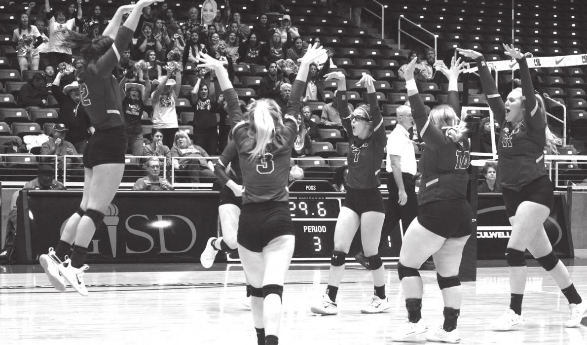 The Lady Lions celebrate a block in the state title match. Photo by Jeff Wick