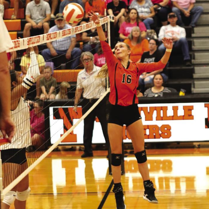 Schulenburg’s Jenna Guentert tips a ball over the net in Friday’s victory at Smithville. Photo by Audrey Kristynik
