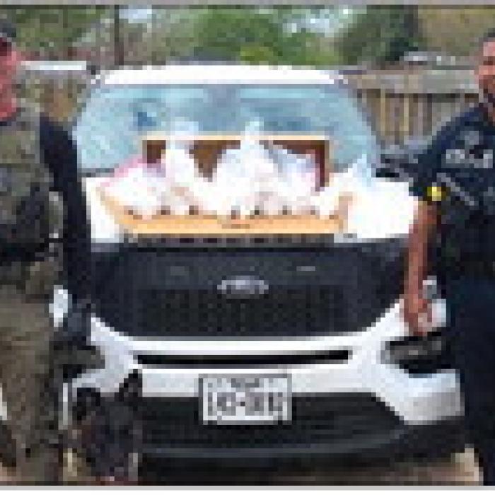 Sgt. Randy Thumann and Schulenburg Police Officer Byron Powe pose with the meth seized Wednesday.