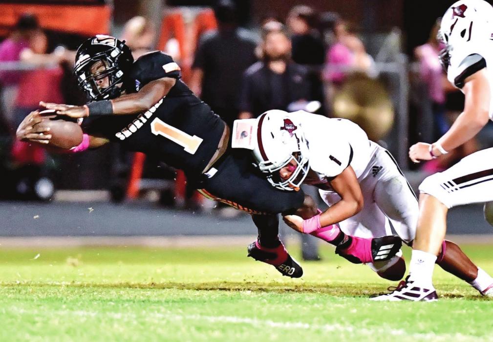 Fidel Venegas is ready with a tackle just as a Shorthorn Kenny King makes a catch in Friday night’s district opener in Schulenburg. Photo by Stephanie Steinhauser