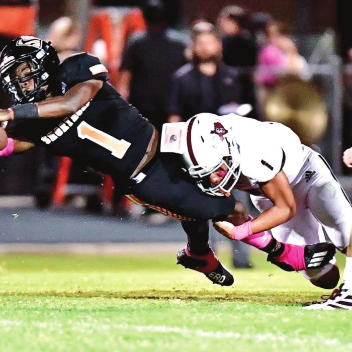 Fidel Venegas is ready with a tackle just as a Shorthorn Kenny King makes a catch in Friday night’s district opener in Schulenburg. Photo by Stephanie Steinhauser
