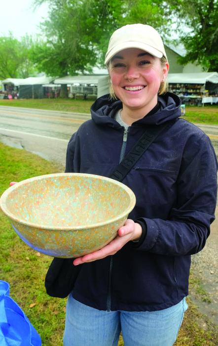 Corrine Carlson of San Francisco, California, shows off a vintage bowl she found while shopping with her family this week in Warrenton. Photos by Andy Behlen