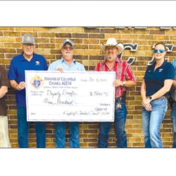 The Knight of Columbus Chromcik Council No. 2574, La Grange, Volunteer Work Group No. 4, made a donation of $500 to the Deputy Santa Program. Presenting the check were three volunteers from Work Group No. 4, Rusty Freedman, Steve Seberger, and Glen Weyand. Receiving the check were Lt. David Beyer, Angela Lala and Jeremy Castleberry.