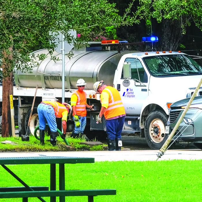 A crew from the Texas Department of Transportation cleaned out the stormwater drain under US 77 near the Faison Home and Fayette Public Library in La Grange. That area has been prone to flooding during heavy rains. La Grange City Manager Jack Thompson said the work will hopefully improve drainage in that area. Staff photo by Andy Behlen