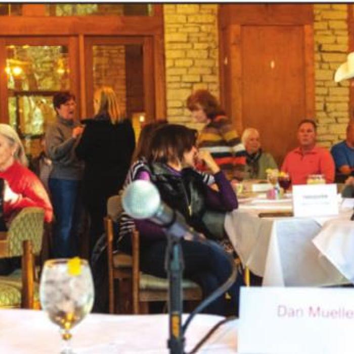 Attendees gather before Saturday’s forum at Frisch Auf!