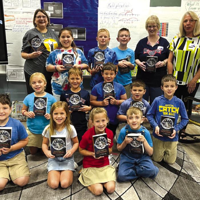 The Fayette County Republican Women recently donated dictionaries to third grade students at Sacred Heart Catholic School.