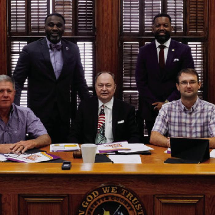 Prairie View A&amp;M Extension Agent Ronnie McDonald (back, left) and Natriez Peterson (back, right), assistant program leader at Prairie View A&amp;M Extension, introduced themselves to the Fayette County Commissioners Court last Thursday. They are pictured with (seated, from left) Pct. 4 Commissioner Drew Brossmann, Pct. 3 Commissioner Harvey Berckenhoff, County Judge Dan Mueller, Pct. 2 Commissioner Clint Sternadel and Pct. 1 Commissioner Jason McBroom. Photo by Andy Behlen