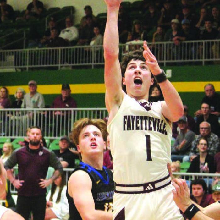 Fayetteville’s Mason Fenhaus drives to the hoop Monday. Photo by Jeff Wick