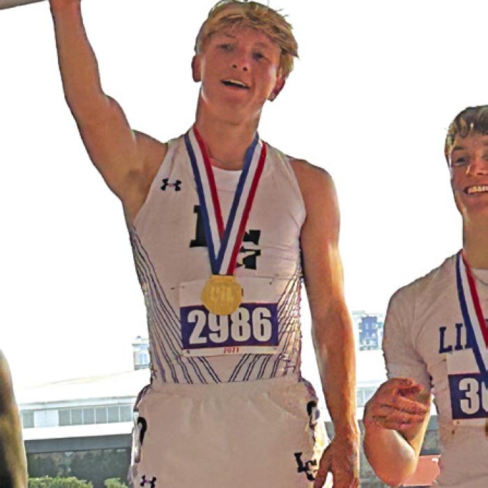 Austen Diggs on the medal stand after his win.
