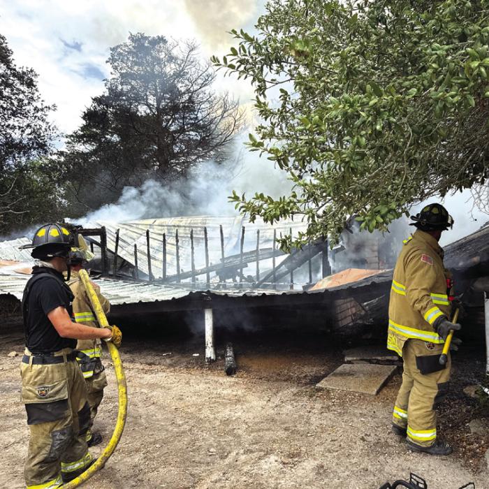 A shot of the still-smoldering Ciztler Retreat Center after the fire was extinguished Saturday.