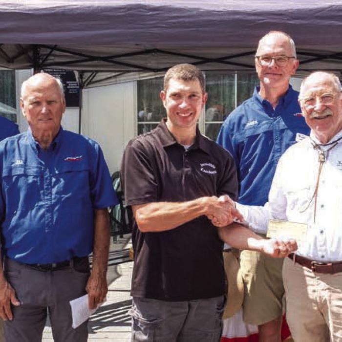Local fundraising group The Incredible Knockouts presented a $500 donation to the Texas Czech Heritage and Cultural Center. Pictured are Edward Kozel of the Incredible Knockouts presenting the donation to TCHCC Vice President Bill Schovajsa along with (back, from left) TCHCC board members James Steffek, Walter Stoever, J.G. Hrncir, John Bartos and TCHCC Manager Mark Hermes.