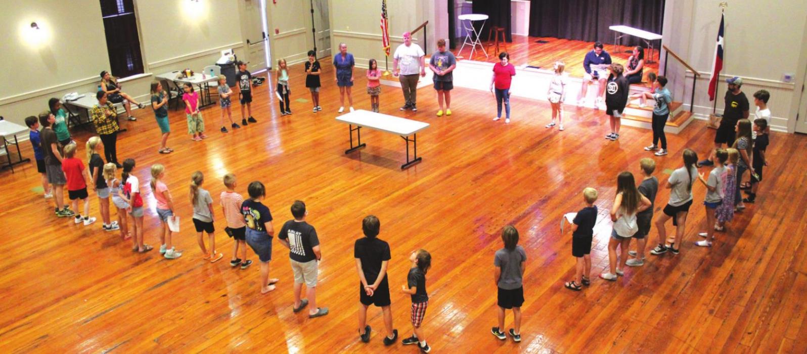 Student actors and crew warm-up prior to the start of rehearsals Thursday at the Casino Hall in La Grange for the upcoming all-student play “The Jungle Book” Aug. 13-15. Photos by Jeff Wick