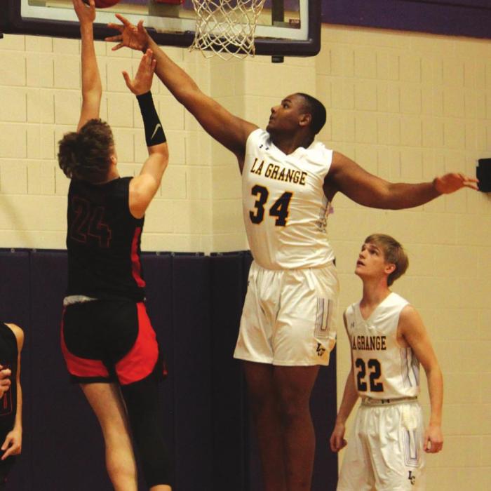 La Grange’s Jaron Woods contests the shot of Smithville’s Joseph Mokry Friday.