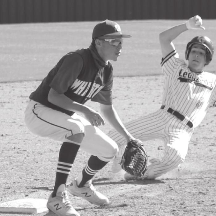 Right: Cameron Kruse safely slides into third base during Wednesday’s game. Photos by Jeff Wick