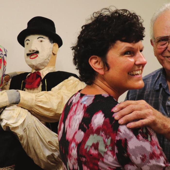 George Kana Jr. and his daughter Lisa dance alongside wooden dancing couple that George’s father and family members constructed for an Armistice Day parade in 1939. The wooden dancers are currently on display at the Fayette Public Library in La Grange.