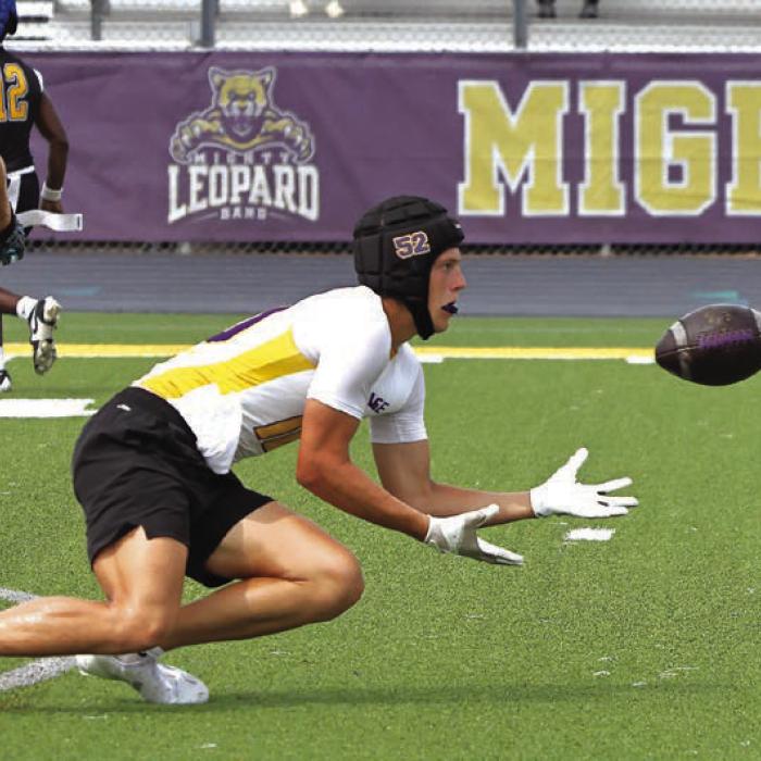 La Grange’s Koen Zbranek gets low to make this catch Friday. Photo by Darrell D. Gest