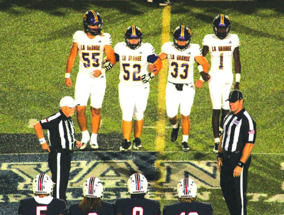 La Grange captains Shawn Skoruppa (55), Austin Williams (52), Austin Roe (33) and Thai Scott come to midfield for the coin toss. Photo by Jeff Wick