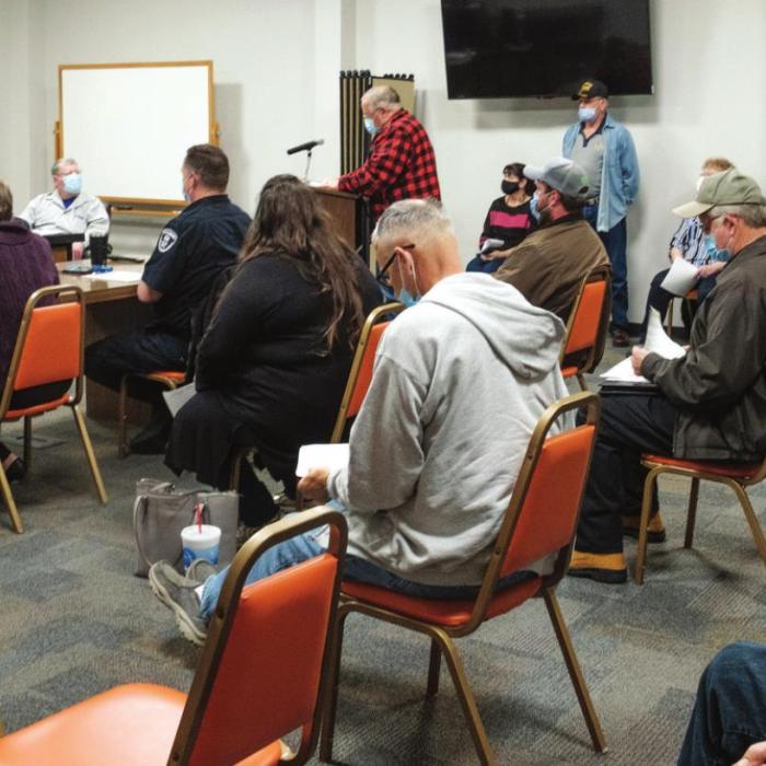 Above, a large crowd filled the Schulenburg City Council chambers on Monday, March 1. Many of the citizens who attended spoke out against the Texan Store that developers plan to build at the corner of Interstate 10 and US 77. Right, Mayor Elaine Kocian takes a moment to contemplate the deciding vote she cast in a 3-2 decision to rezone the Texan property for commercial use. Photos by Andy Behlen