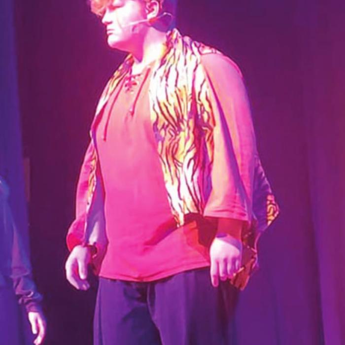 La Grange junior Hayden Splawn in his Leopard jersey and on stage last week as the main villain Shere Khan the tiger in the performance of “The Jungle Book” at the Casino Hall in La Grange. Photos by Jeff Wick and Jessica Montez