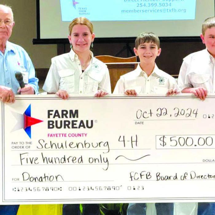 Fayette County Farm Bureau secretary Mike Dittrich presented Schulenburg 4-H officers with a donation of $500 as a thank you for their participation in the County Farm Bureau’s annual meeting.
