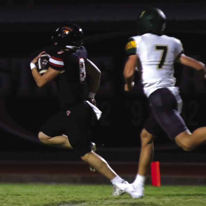 Schulenburg quarterback Owen Brenek runs for one of his two first quarter touchdowns Friday. Photo by Audrey Kristynik