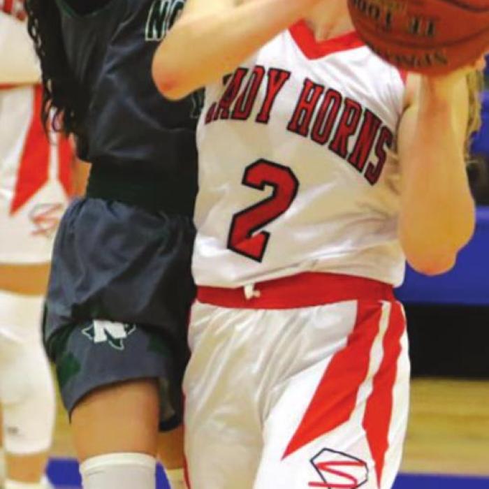 Schulenburg’s Julie Guentert, right, and Erica Otto, left, in action in Monday’s playoff game. Photos by Audrey Kristynik