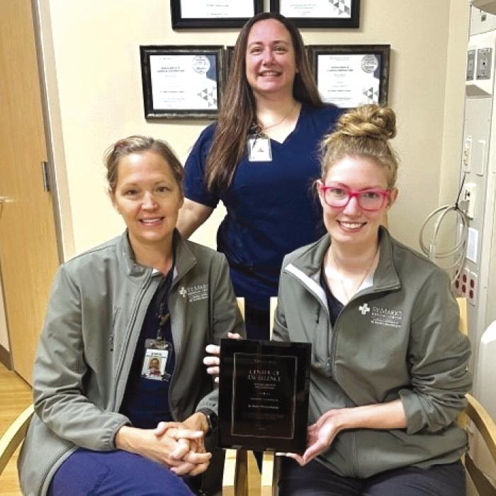 St. Mark’s Advanced Outpatient Wound Center team, front from left: Stacie Schramek, RN, and Jackie Faigle, FNP-C; back row, Jennifer Scott, RN, Program Director, with the team’s Restorix-Health Clinical Distinction Award. The team is one of only 26 in the US to achieve the goals in wound healing rates and safety.