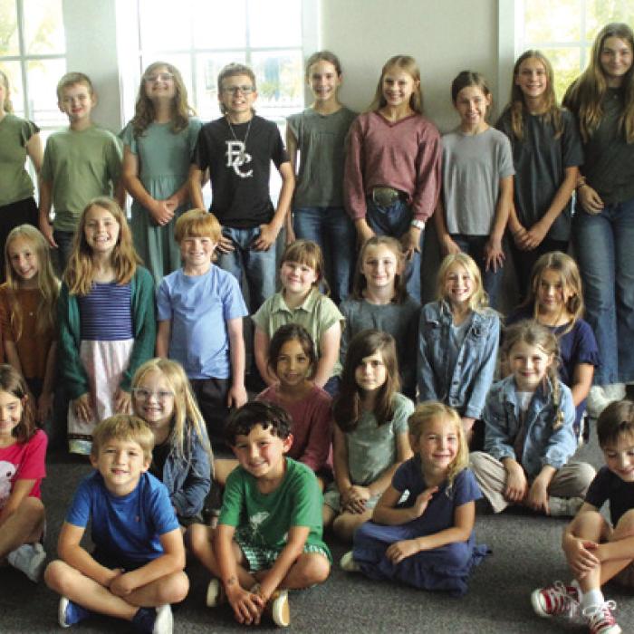 Dozens of the Fayetteville ISD kids who volunteered to be in a scene Thursday at their library. Photos by Jeff Wick