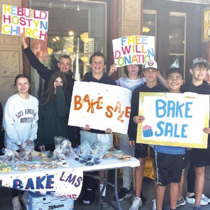 All of the La Grange 8th grade home room classes are working on special community service projects this semester. Mrs. Little’s homeroom decided to raise money to help rebuild the Hostyn church which was destroyed in a gas explosion last summer. Here those students are shown at their bake sale last Saturday. Photo by Jeff Wick
