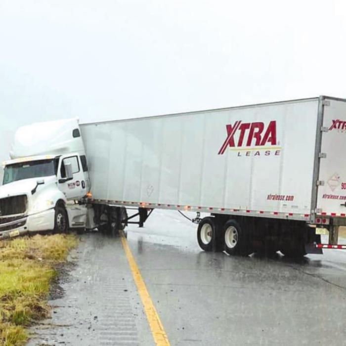 Wet conditions contributed to a number of traffic accidents around teh County on Monday, including this 18-wheeler that jackknifed on Interstate 10 near Schulenburg. Photo courtesy of the Fayette County Sheriff’s Office