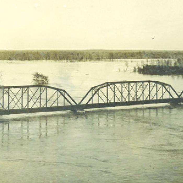 Photograph of the MKT railroad bridge across the Colorado River at La Grange on the evening of Dec. 5, 1913. Photo ourtesy of the Fayette Heritage Museum and Archives
