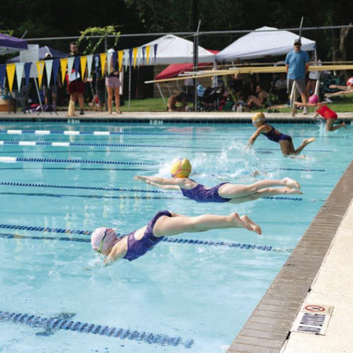FAST youngsters jump into the pool during a recent race. Photo by Brittany Dawson