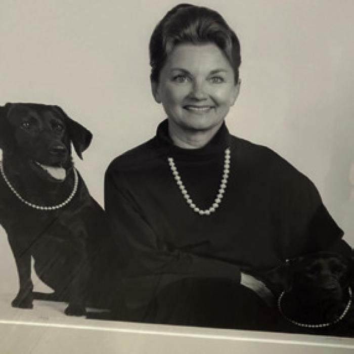 Pinky Wilson and her two Labrador girls, all sporting their pearl necklaces.