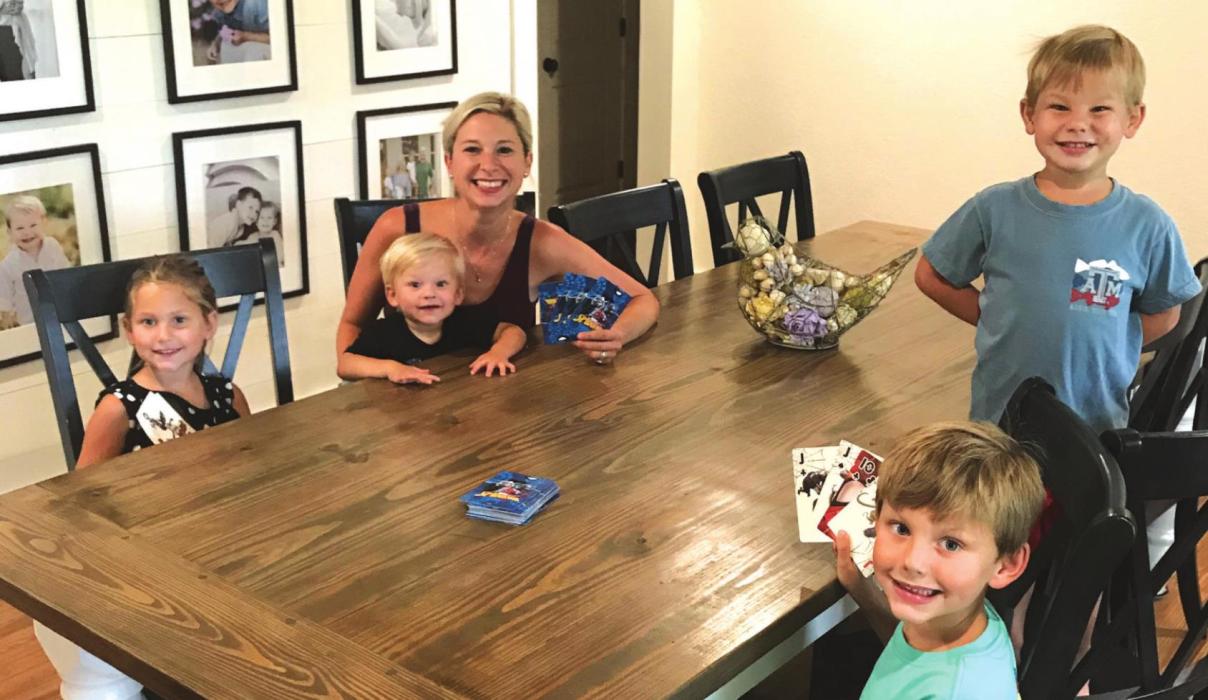 Robyn Ulrich is shown here playing cards with her kids as they find ways to pass time while isolating. None of her four kids have shown signs of the virus. Photos courtesy of Robyn Ulrich