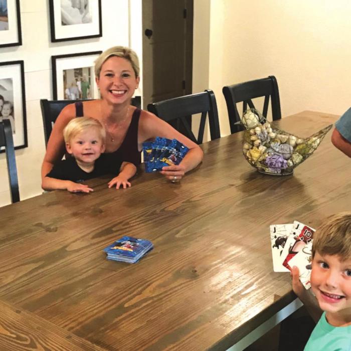 Robyn Ulrich is shown here playing cards with her kids as they find ways to pass time while isolating. None of her four kids have shown signs of the virus. Photos courtesy of Robyn Ulrich