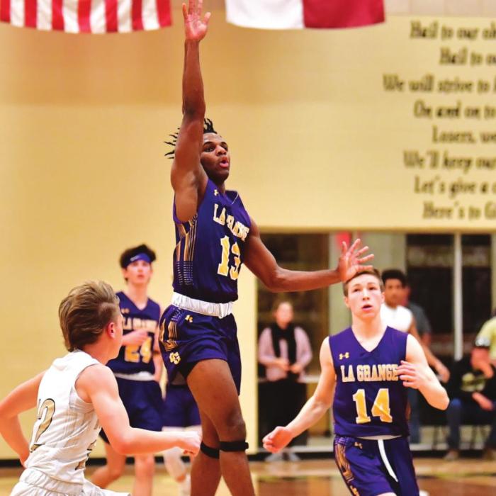 Dana Baker was the lone senior on this year’s Leps basketball team. He is shown here making a buzzer-beating three-pointer at the end of a quarter against Giddings in the regular season finale. Photo by Stephanie Steinhauser