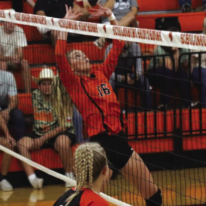 Schulenburg’s Jenna Guentert sets a ball in Tuesday’s victory over Smithville. Photo by Audrey Kristynik