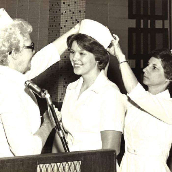 Above: Brenda Belota at her graduation from nursing school. Below, left: Brenda Belota in her early days at La Grange Family Health when the clinic was on Guadalupe Street. Below, left: Brenda and her late husband Gilbert Belota