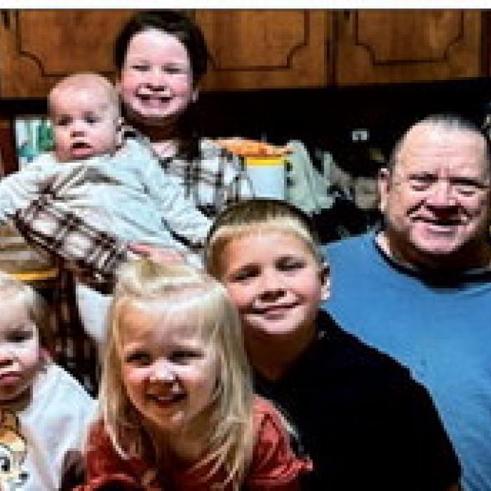 Brenda and Gilbert Belota with their grandkids.