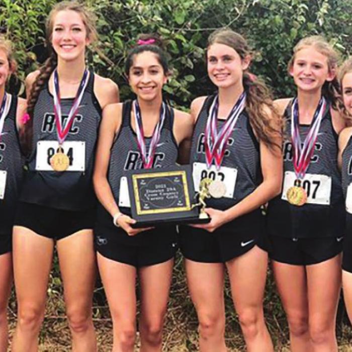 The District 29-1A varsity championship cross country teams, the Fayetteville boys (left) and the Round Top-Carmine girls, right.