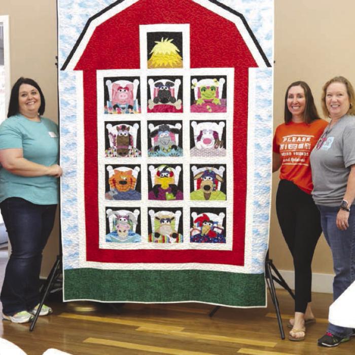 Guild Donates Quilt to Animal Shelter