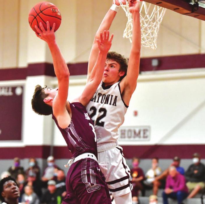 Hagan Wagner denies an Indian a basket in the first half of Tuesday’s game against Ganado. Photo by Stephanie Steinhauser
