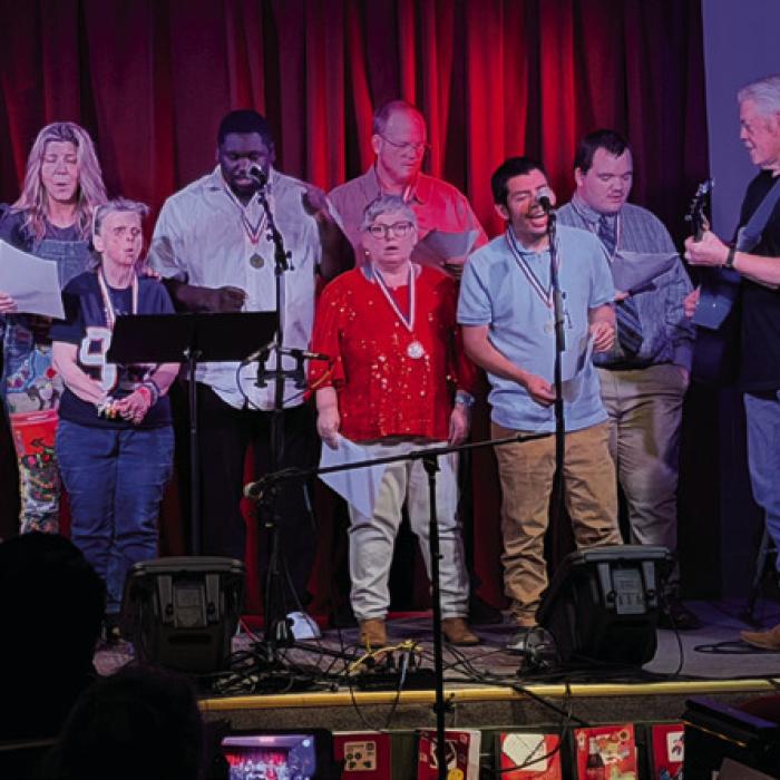 Above, Grammy winners Terri Hendrix and Lloyd Maines perform with the Gray Legacy Bluebird Choir during the finale of the SongBuddies concert last Wednesday.