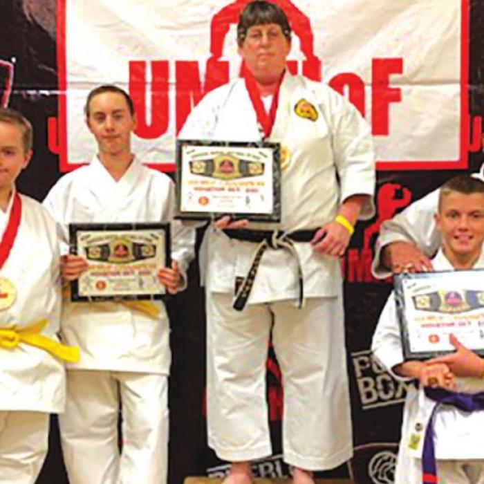 Sensei Angela Sutton, Chad Eckermann, Case Eckermann, Carter Wunderlich and Bailey Wunderlich at their recent competition.