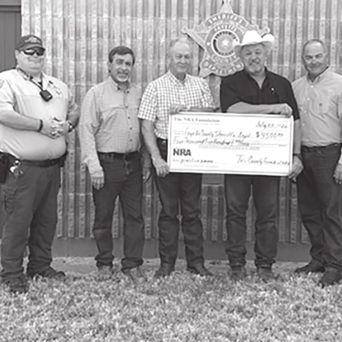 Deputies receiving the grant check are shown above, from left to right: Investigator Kenn Kretz, Charles Murray, Deputy Lee Phillips, John Salem, Dennis Brower, Sheriff Keith Korenek, Craig Schulz, Lt. David Beyer and Sgt. Ron Naumann.