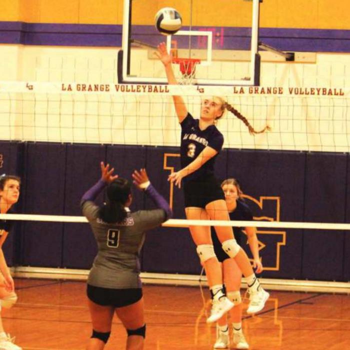 Lanie Doyle spikes a ball in Saturday’s match against Austin LBJ. Photos by Jeff Wick