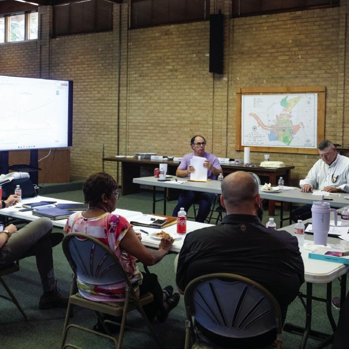 Chris Casey of Parkhill (standing to the left) listens to the La Grange City Council during a workshop meeting on June 29 over possible improvements to City Hall, the Police Station and Randolph Recreation Center. Photo by Andy Behlen