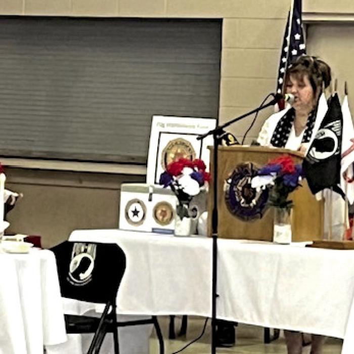 Paula Urban and Angie Pavlicek presenting the premise of the POW/MIA table.